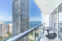 Bay & City Views, Balcony, 35th Floor at Icon Brickell Residences. Longest Pool in Miami.